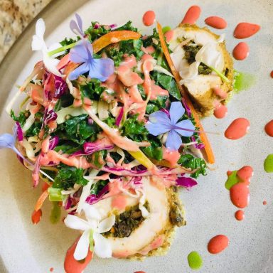 Crusted chicken roulade with a kale salad